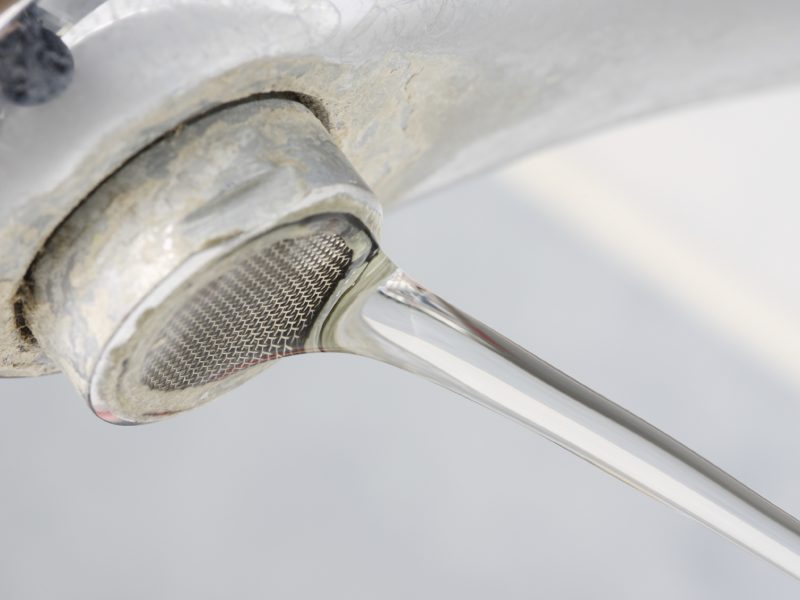 bathroom faucet with hard water stains