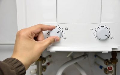 Homeowner adjusting settings on water heater